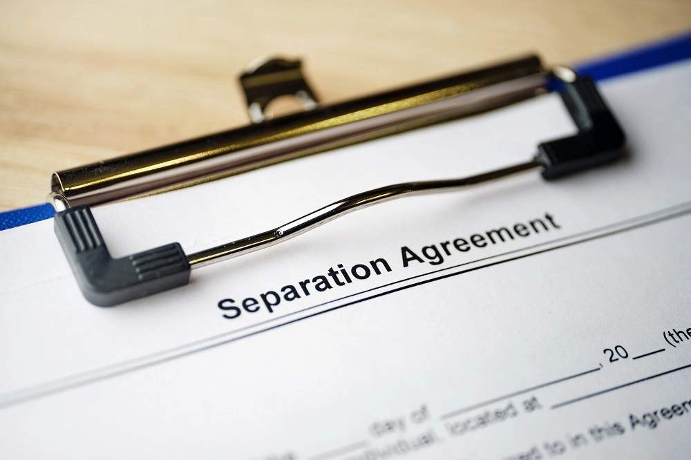 Clipboard holding a separation agreement form