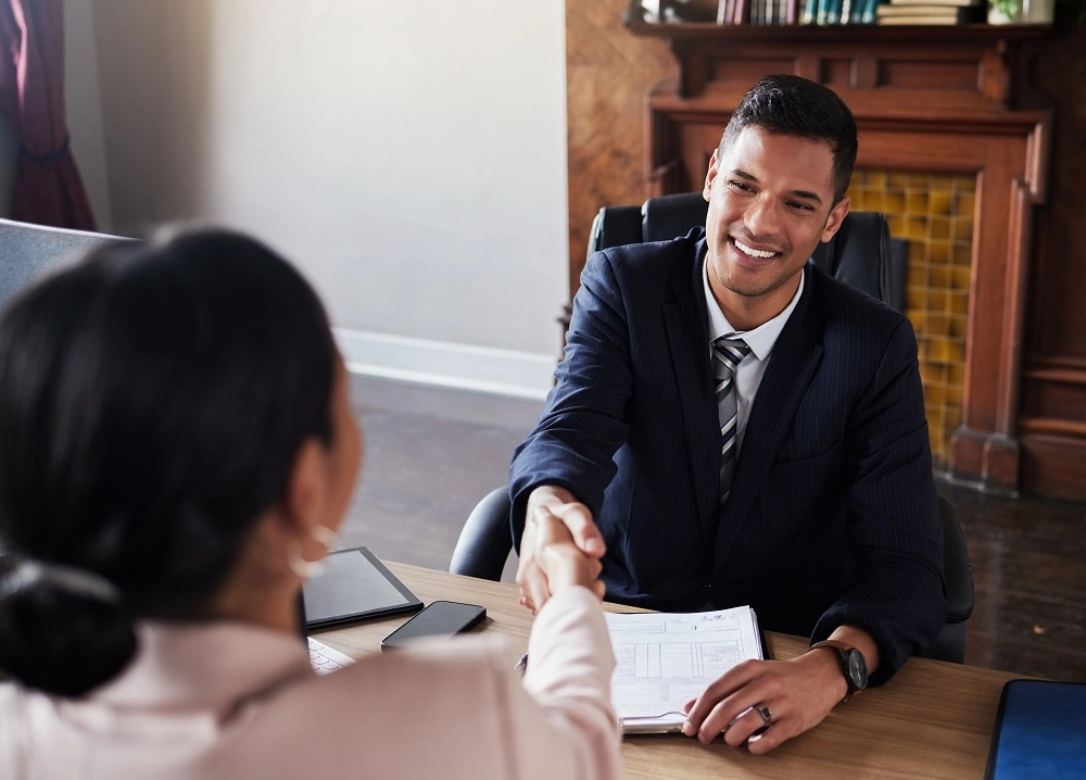 Family law attorney shaking hands with a client