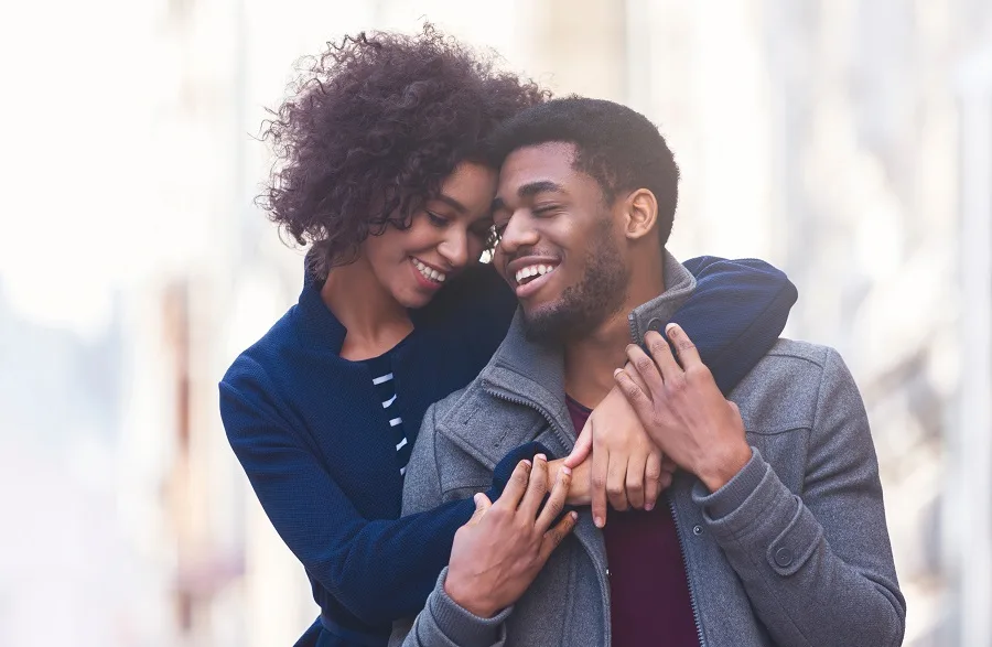 Smiling couple embracing