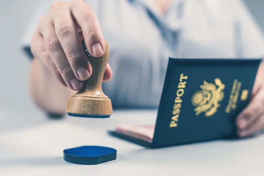 Official stamping a passport